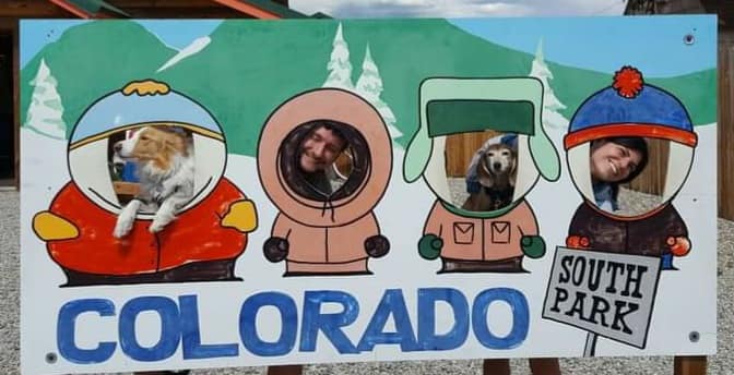 People and dogs at South Park sign in Colorado
